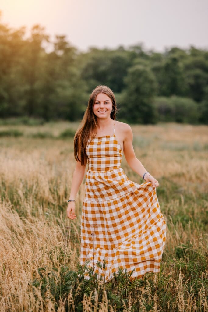 Senior photographed using higher ISO settings at sunset