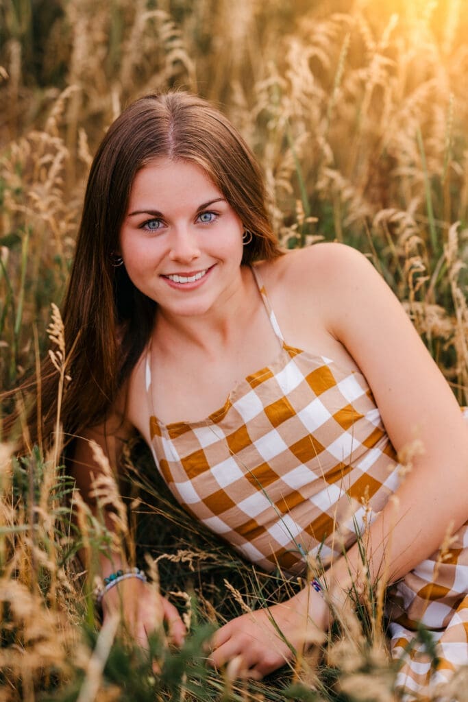 Senior photographed using higher ISO settings at sunset