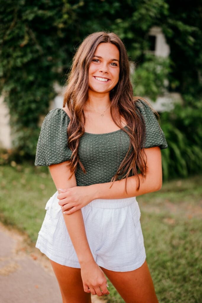 Senior portrait photographed using higher ISO settings at sunset