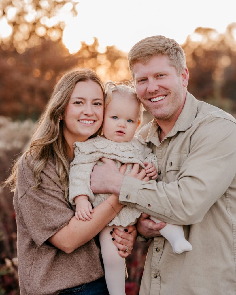 Family during an outdoor portrait session photographed with a fast shutter speed for sharp images.
