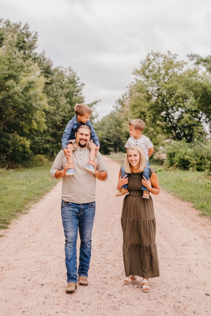 Family during an outdoor portrait session photographed with a fast shutter speed for sharp images.