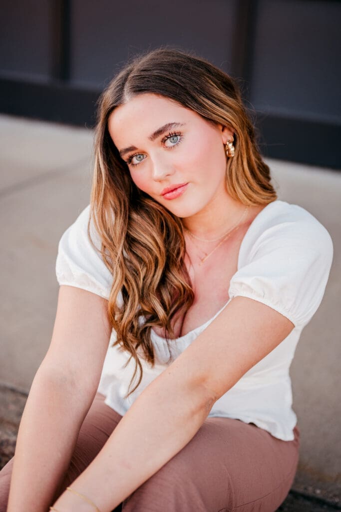 Senior portrait photographed using higher ISO settings at sunset