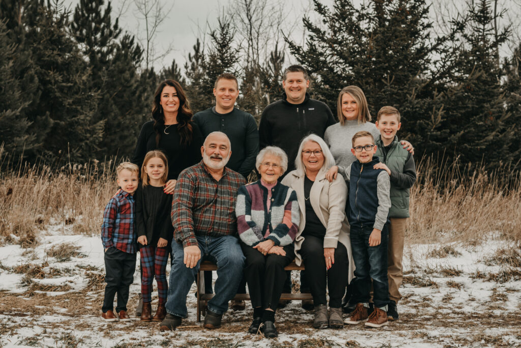 Extended family posing together during an outdoor portrait session