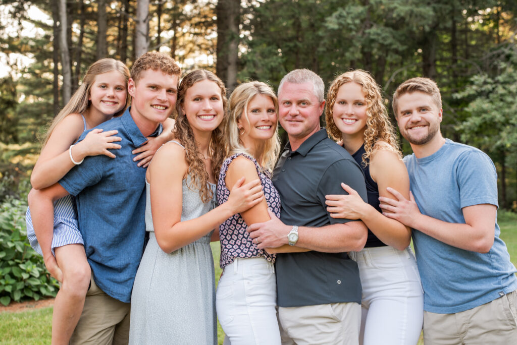Happy family smiling together during an outdoor family photography session