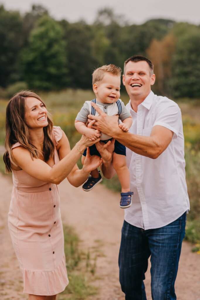 Happy family smiling together during an outdoor family photography session