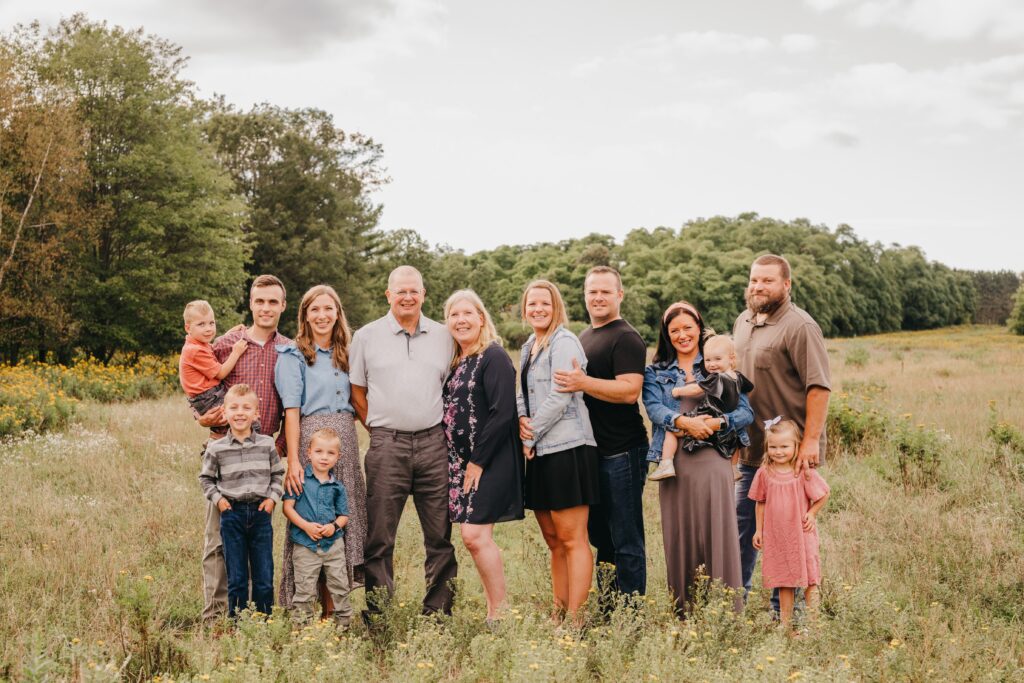 Extended family posing together during an outdoor portrait session
